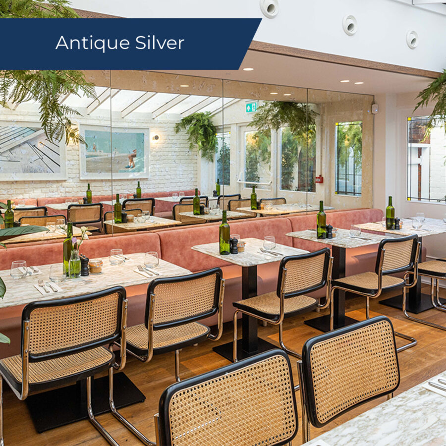 Antique silver mirror on the wall of a restaurant