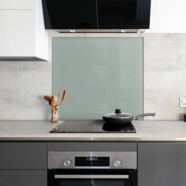 Jade Green Painted Kitchen Splashback on the wall behind a modern stove.